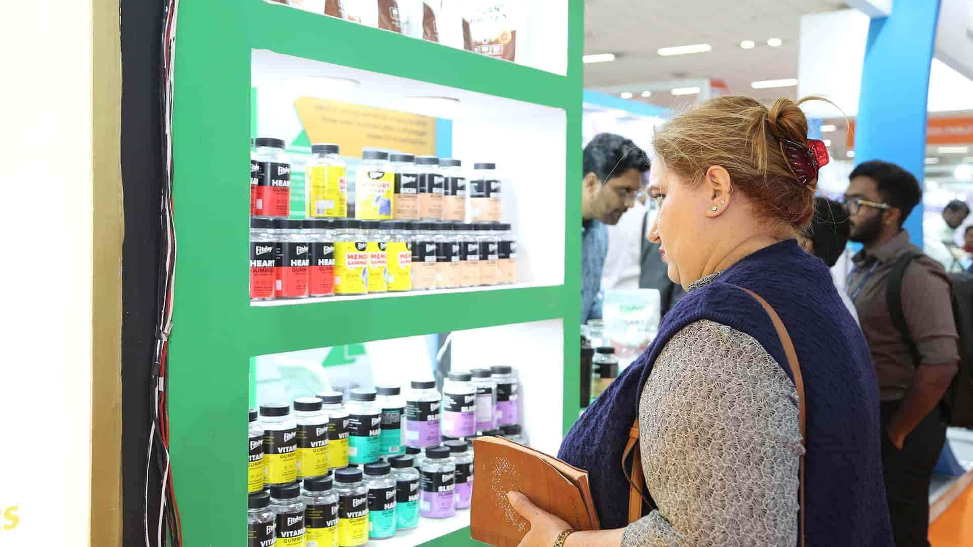 attendee looking at products from a stand