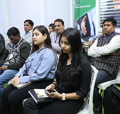 Seated audience attentively listens to a presentation
